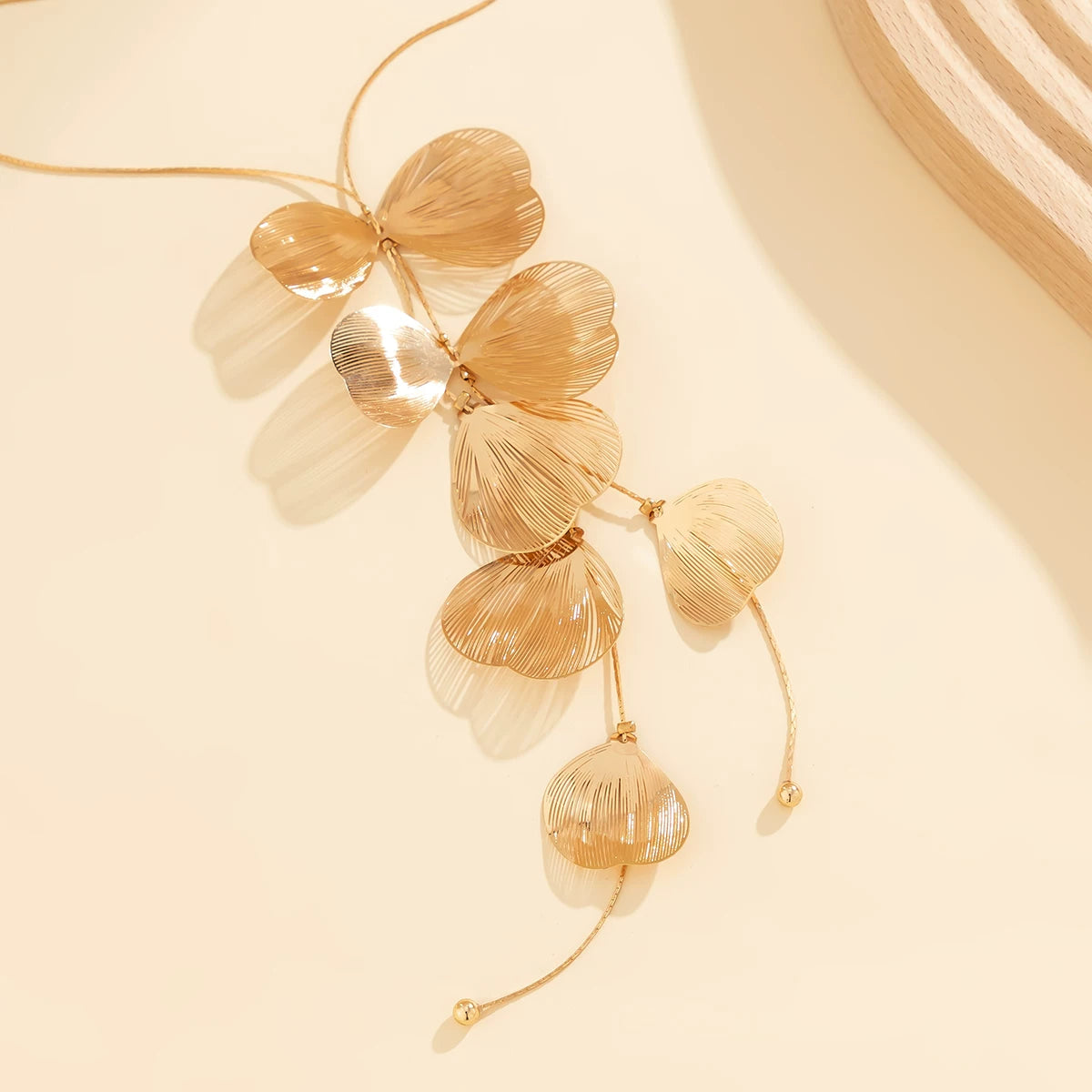 Tassel Ginkgo Leaf Gold Silk Necklace for Women – European & American 2025 Spring Trendy Niche Design Deep V Jewelry Accessory