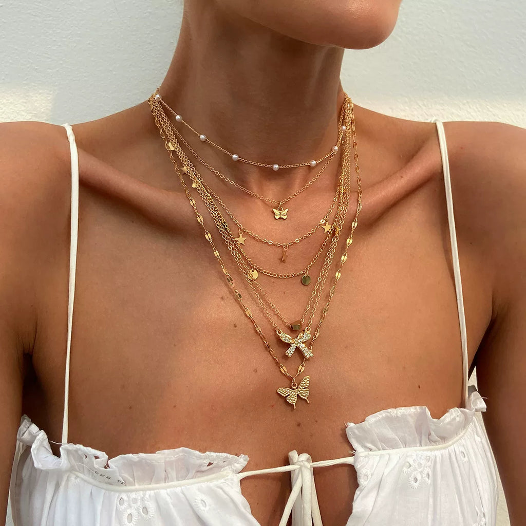 7-Piece Star Butterfly & Peach Heart Necklace Set – Layered Clavicle Chain Design