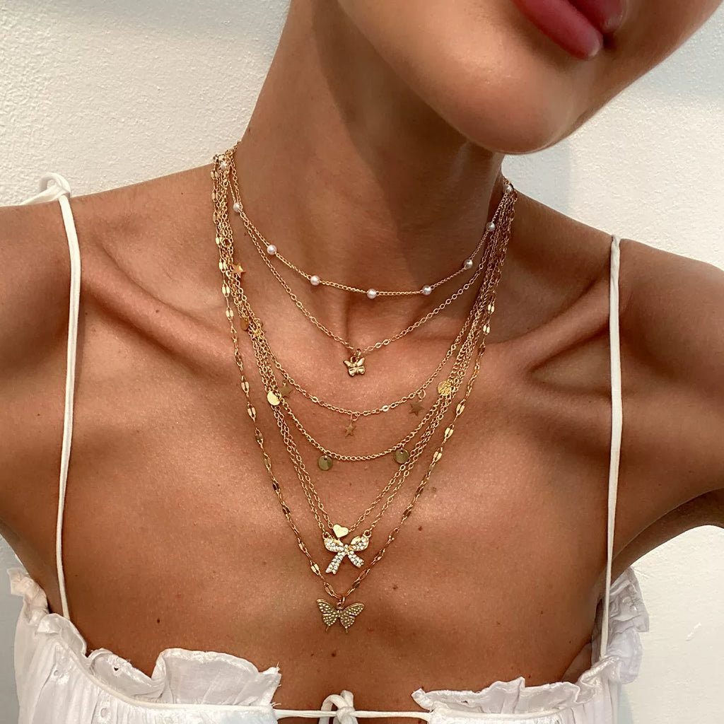 7-Piece Star Butterfly & Peach Heart Necklace Set – Layered Clavicle Chain Design