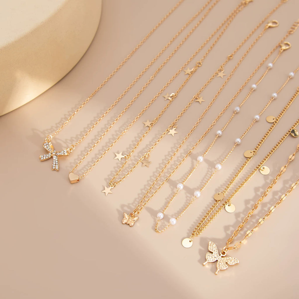 7-Piece Star Butterfly & Peach Heart Necklace Set – Layered Clavicle Chain Design